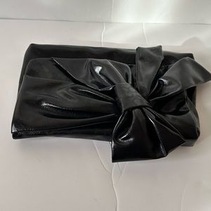 Very simple none leather clutch with bow
